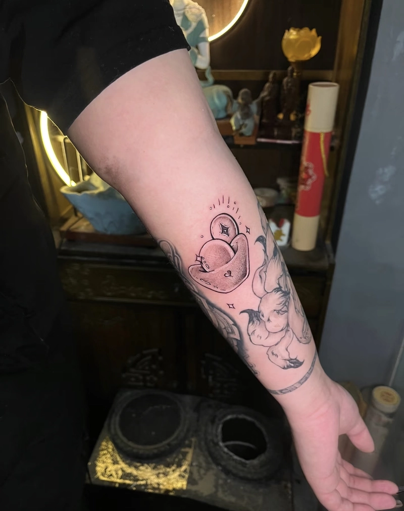 Hình xăm đồng tiền cổ tài lộc