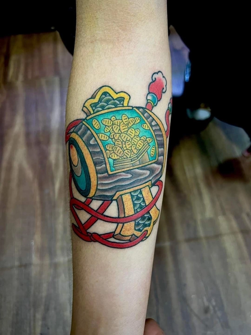 Hình xăm đồng tiền cổ vàng