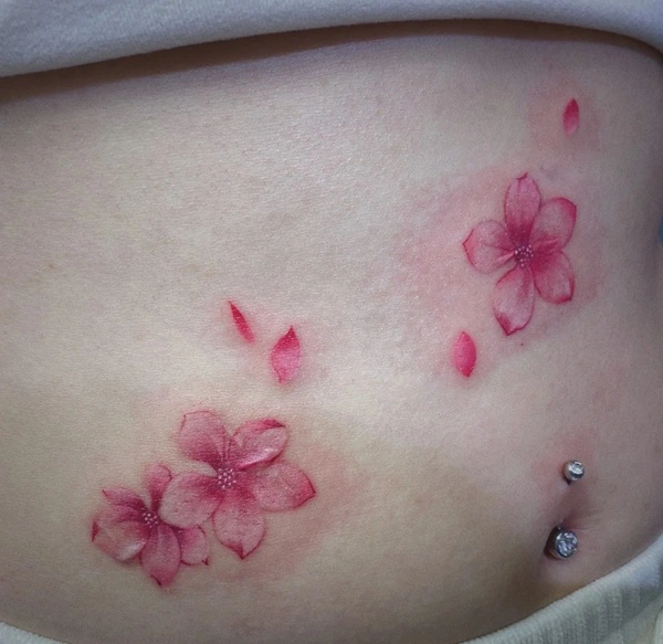 Tattoo hoa anh đào nữ với cánh hoa rơi